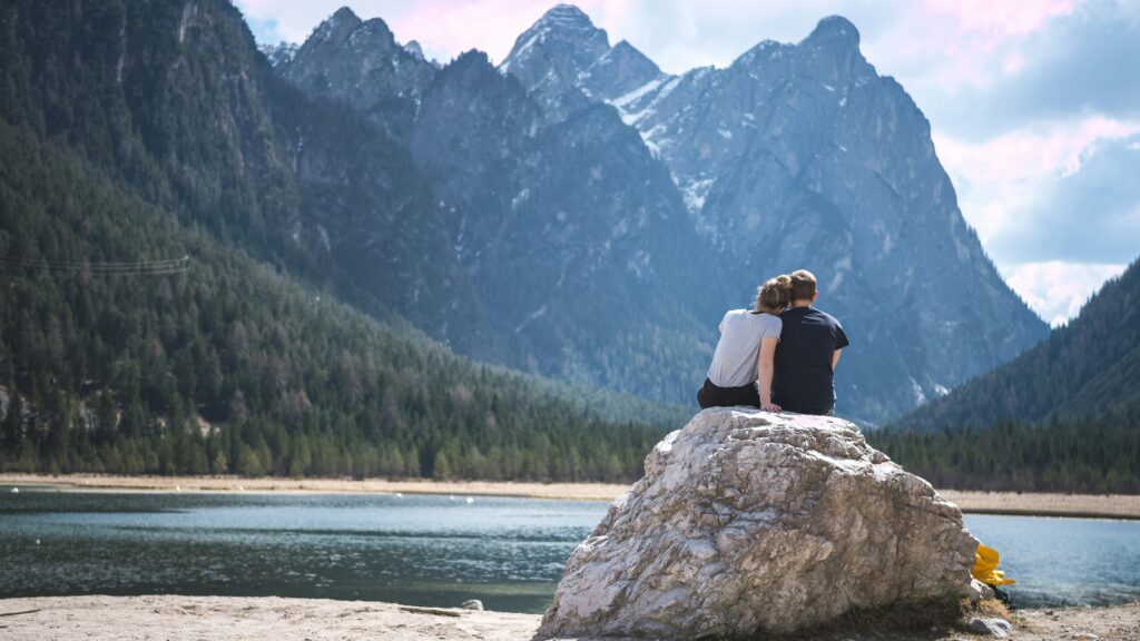 couple having good time beside a lake